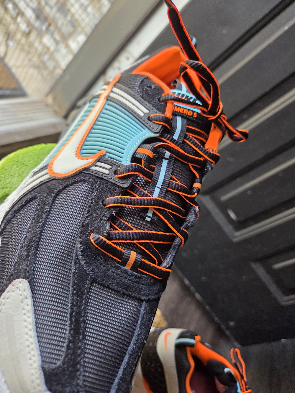 Nike Black Sneakers with Teal and Orange Accents